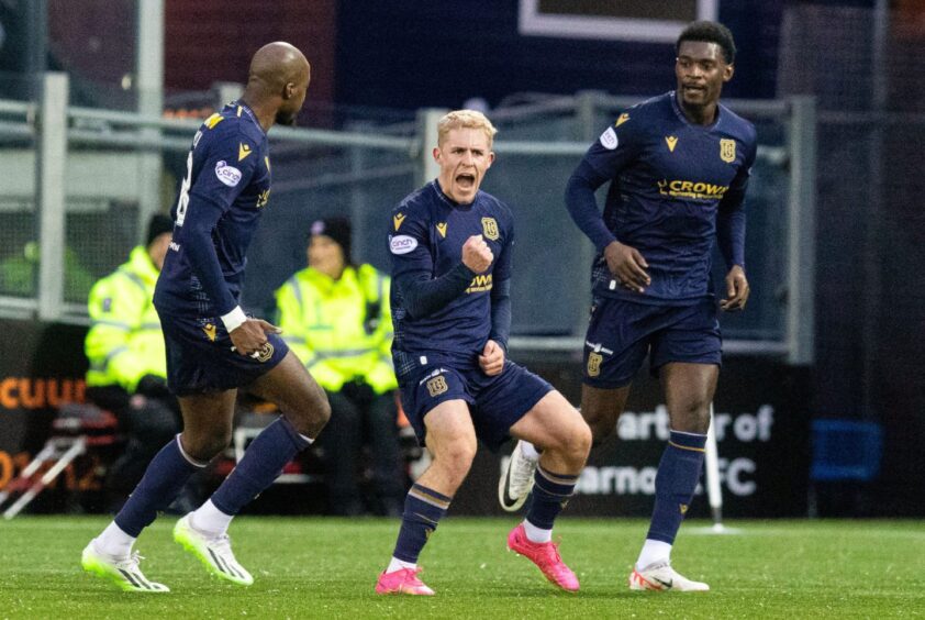 Luke McCowan celebrates making it 1-0 to Dundee at Kilmarnock. Image: SNS