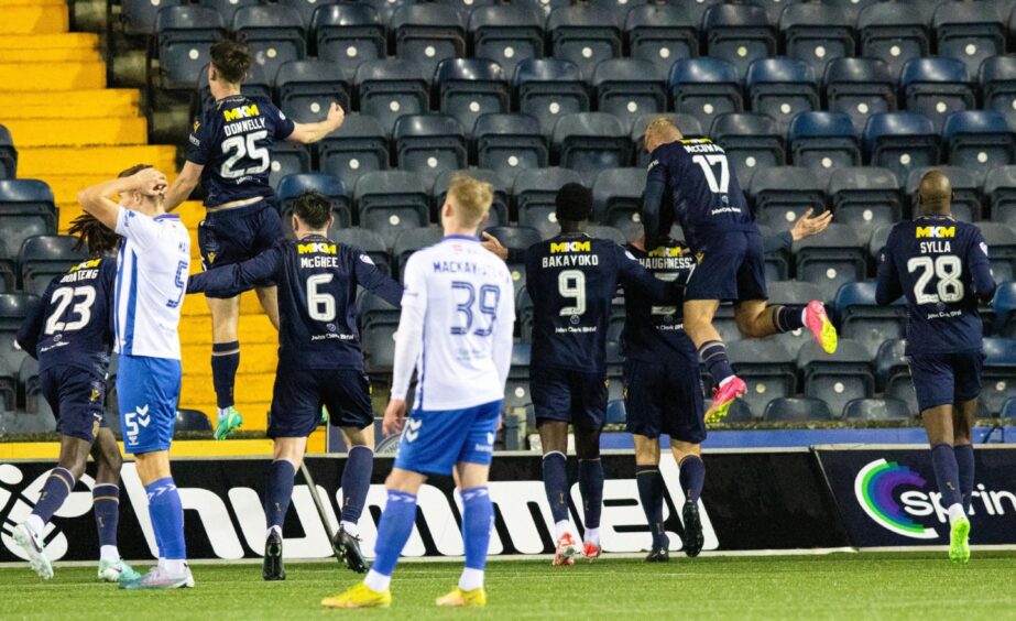 Dundee celebrate Joe Shaughnessy's late header in front of the travelling support. Image: SNS