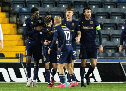 Dundee celebrate Joe Shaughnessy's (right) late header. Image: SNS