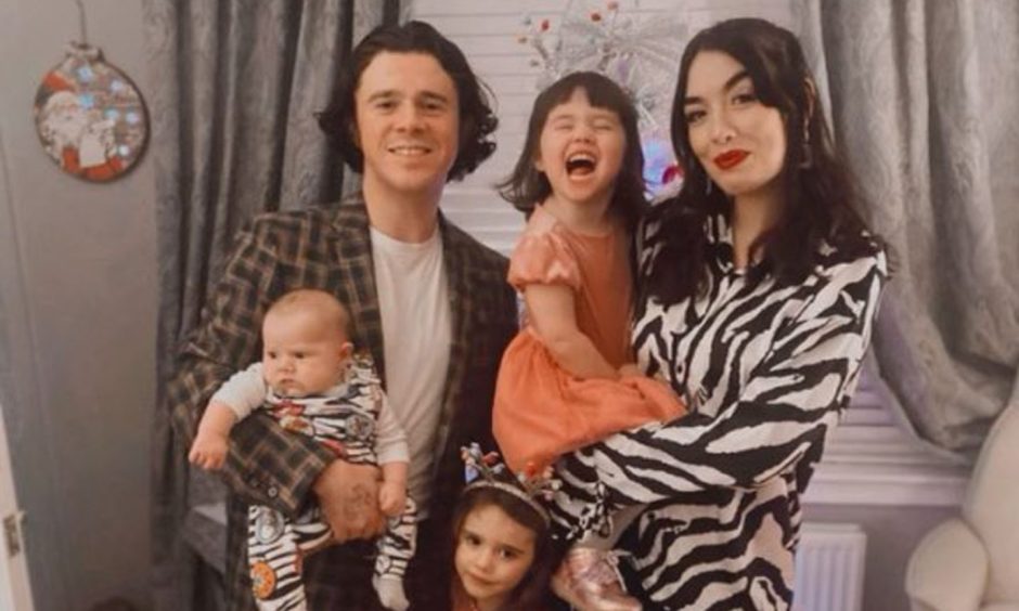 Kyle Falconer holding baby Jet, with partner Laura holding daughter Winnie and eldest daughter Wylde standing between them.
