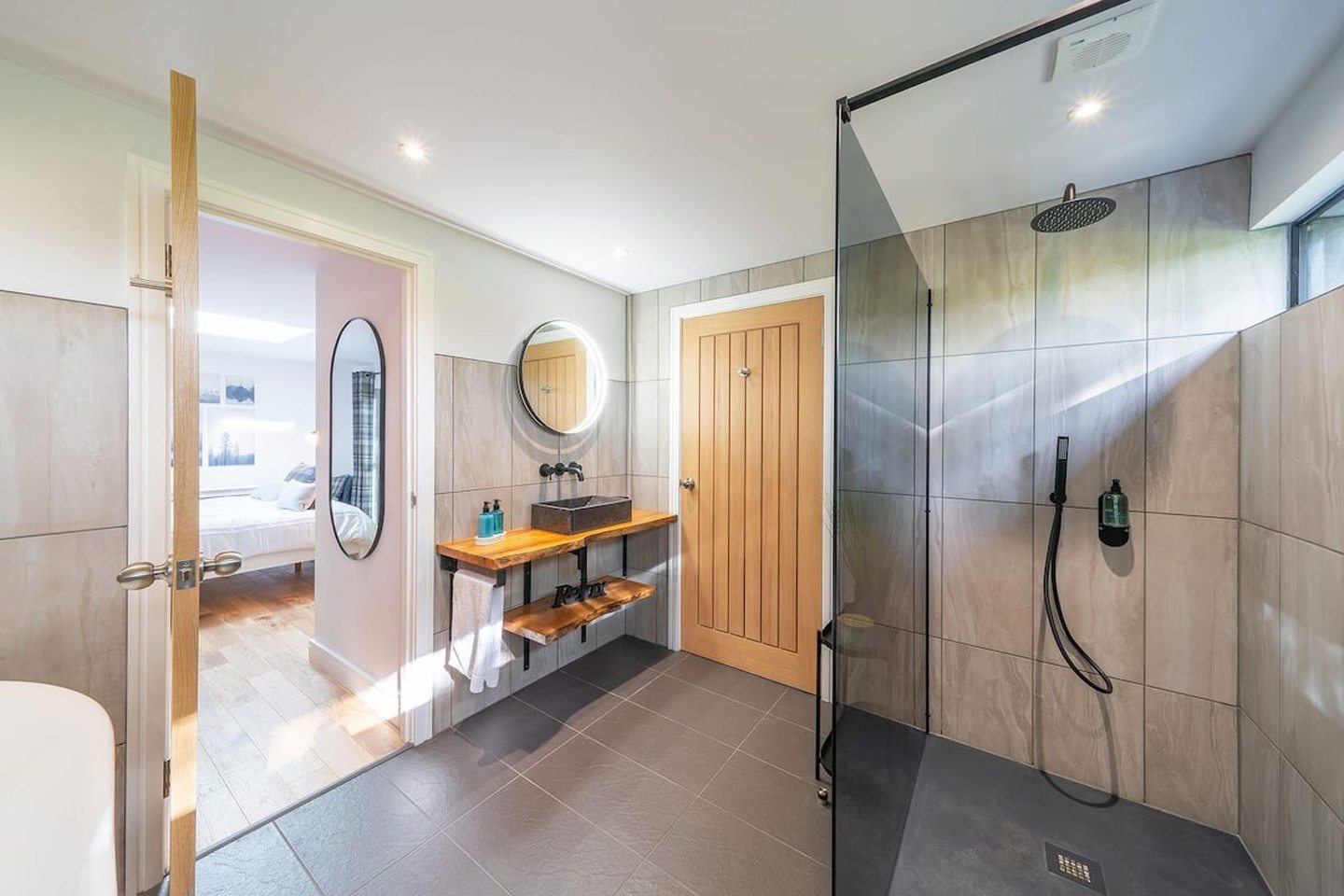 Spacious bathroom in the Auchterhouse property with a walk-in rain shower.