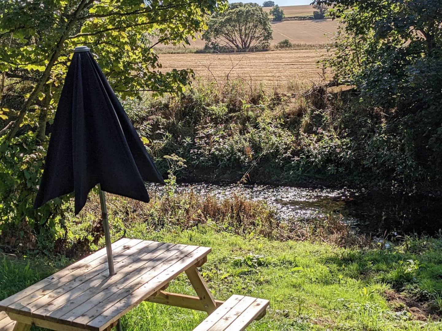 Outdoor space with picnic table and views over the Angus countryside.