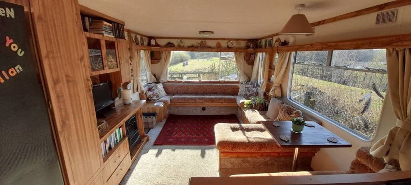 Cosy lounge area with large windows.