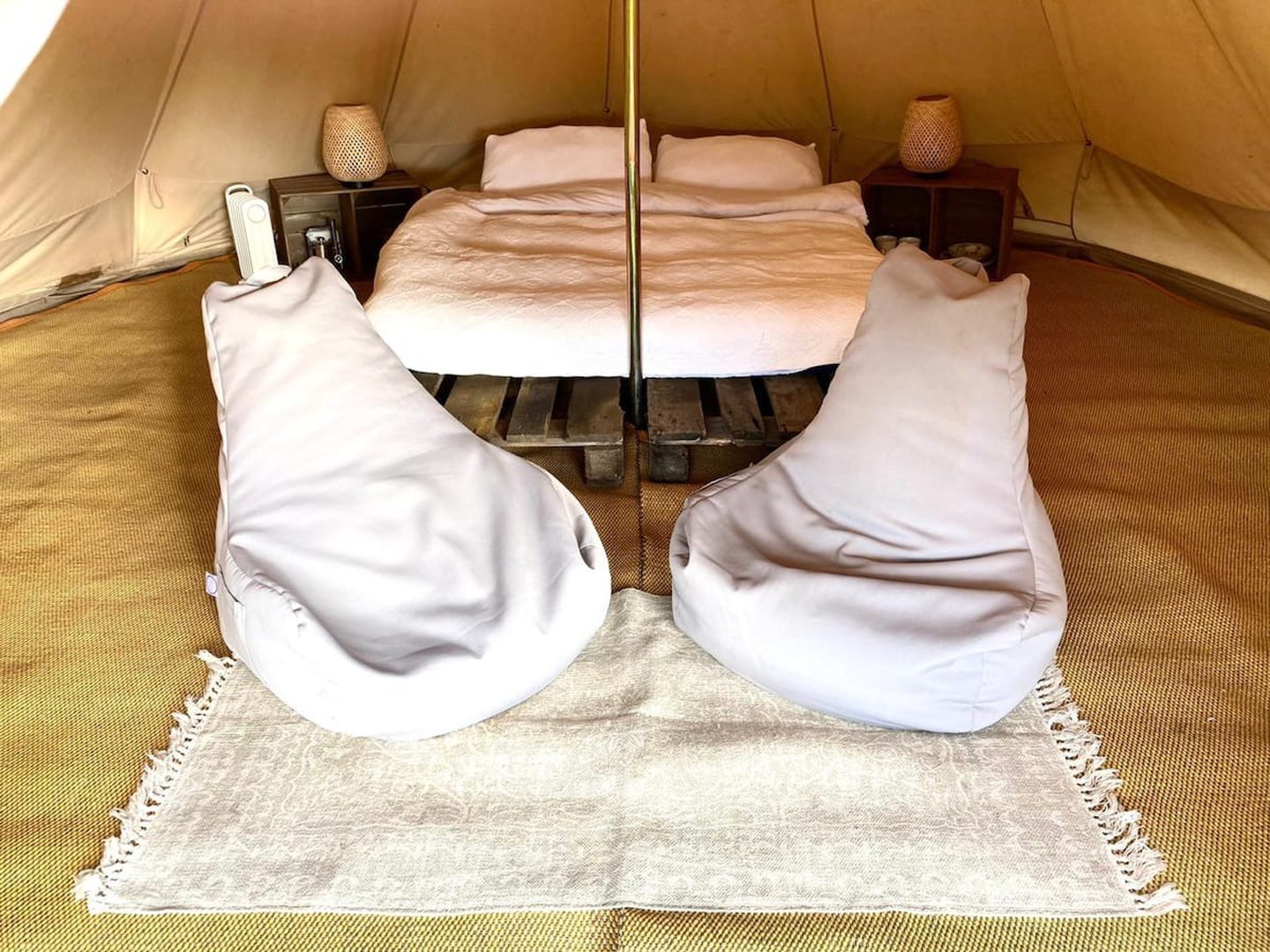Bed and seating inside the Angus yurt.