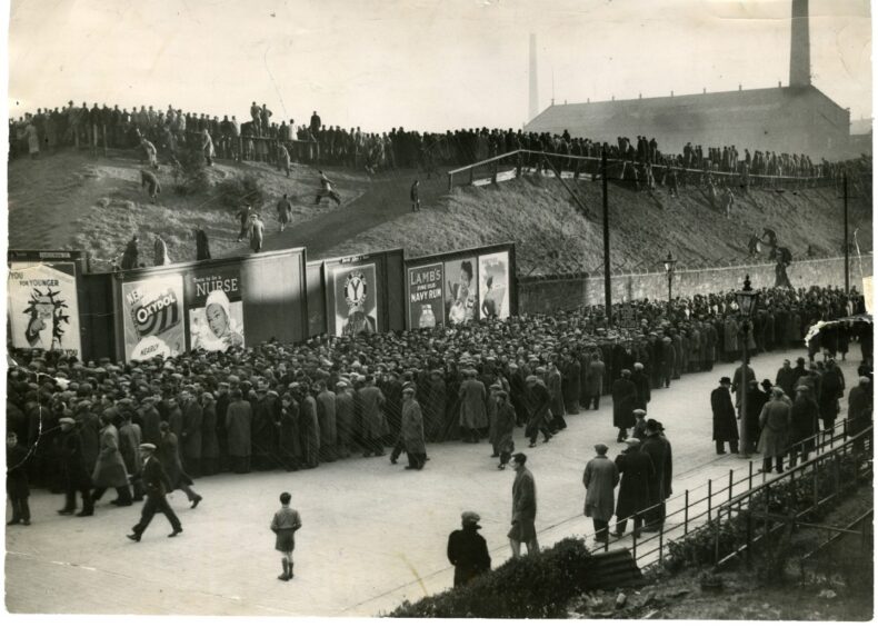 The crowd getting into the ground for the Dundee v Rangers game in 1949. Image: DC Thomson.