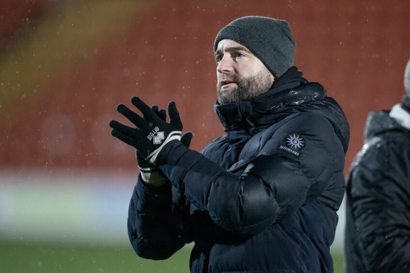 Dunfermline manager James McPake salutes the supporters after the win over Airdrie. Image: Craig Brown/DAFC.