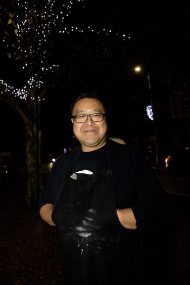Pete Chan next to the Craigie Christmas lights