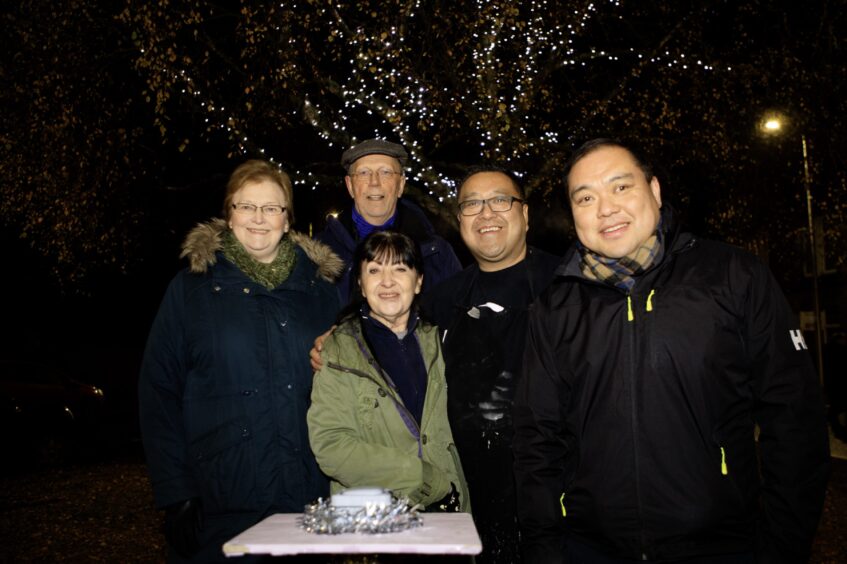 Councillors Sheila McCole and Iain MacPherson, Sue Varga, Pete Chan and councillor Andy Chan wrapped up warm at the Craigie Christmas lights switch-on