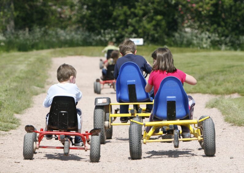 Kids on go-carts at Cairnie Fruit Farm