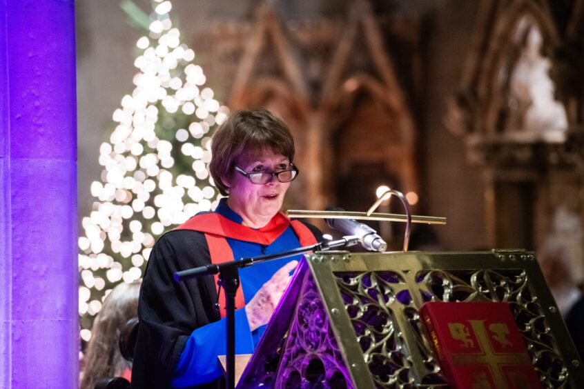 Dundee University Chaplain Dr Fiona Douglas opens the Carols by Candlelight service at St Paul's Cathedral.