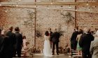 Couple getting married in The Weaving Shed