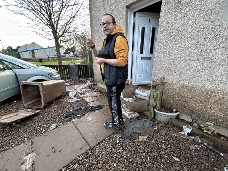 Andrew McIntosh outside his family home.