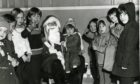 Smiling faces for the visit of Santa at Douglas and Angus Community Centre in 1976. Image: DC Thomson.