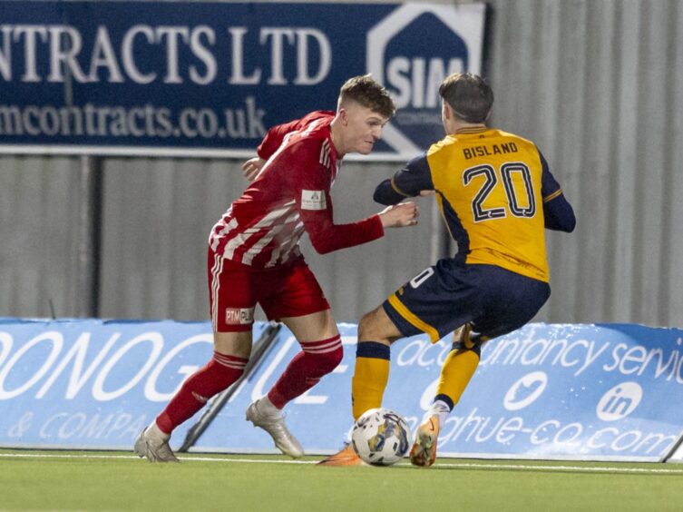 Dundee United kid Layton Bisland in Scottish Cup action against Formartine United