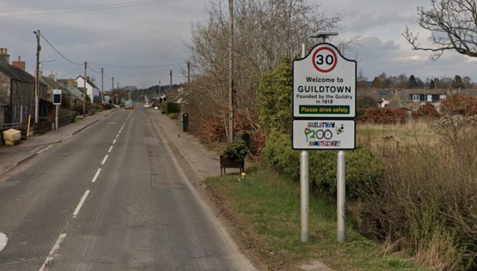 Guildtown street sign with attractive Perthshire village in background