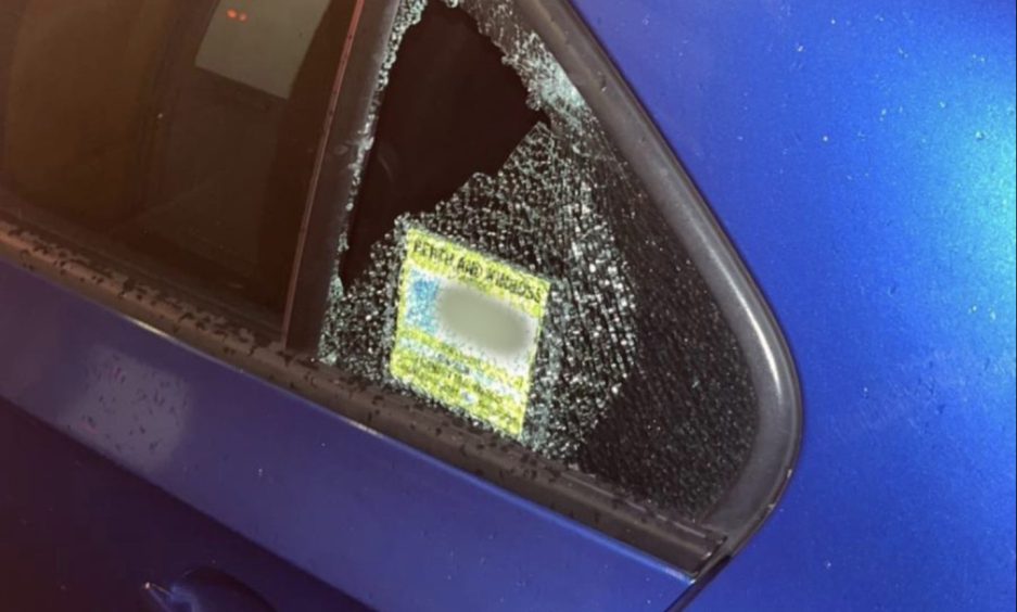 Perth Radio Taxi with smashed window.