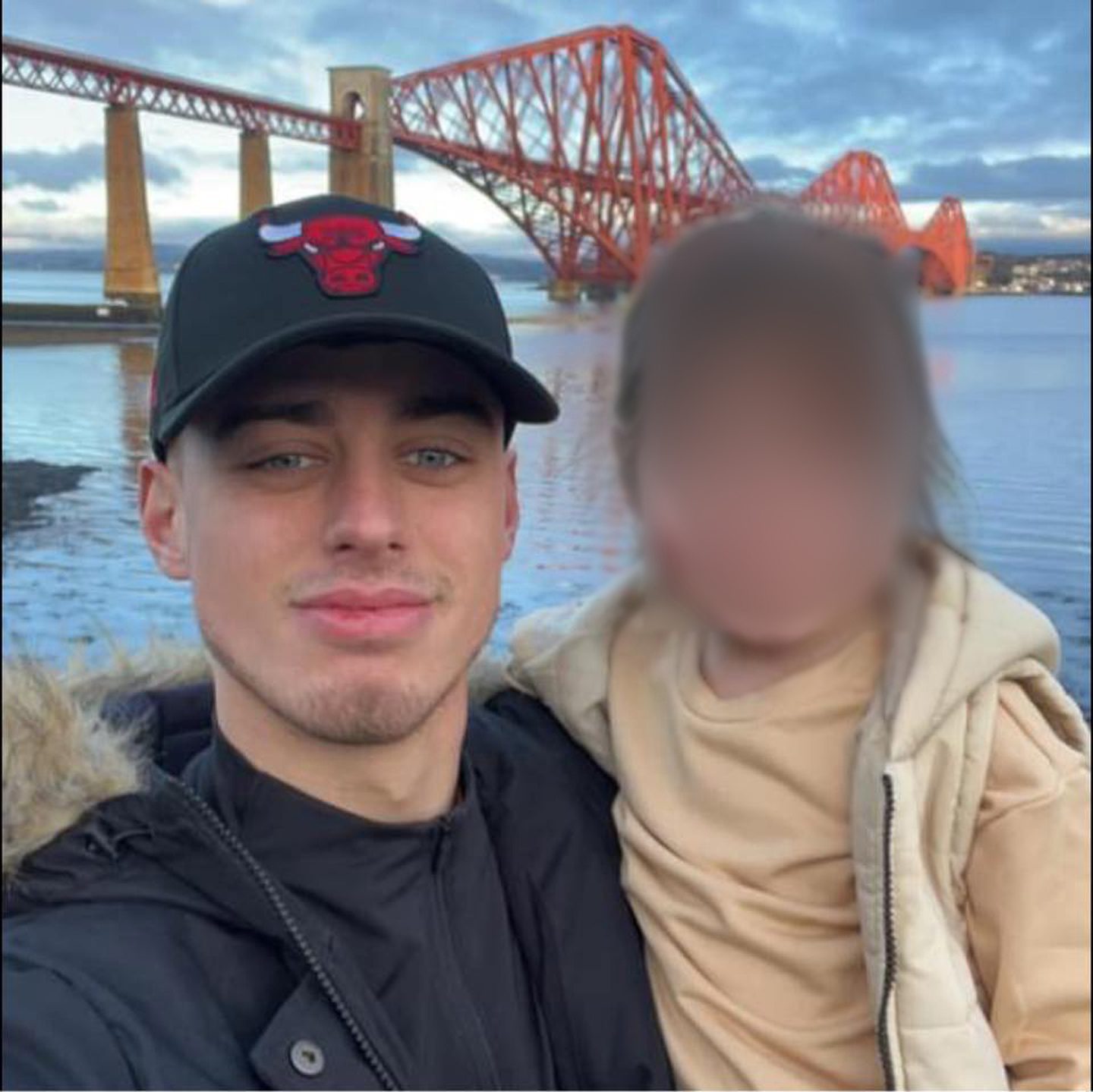 Jordan and his child at the Forth Bridge.