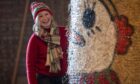 Fleur Baxter has spent this week in a farm shed painting her Christmas bales. Image: Kim Cessford/DC Thomson