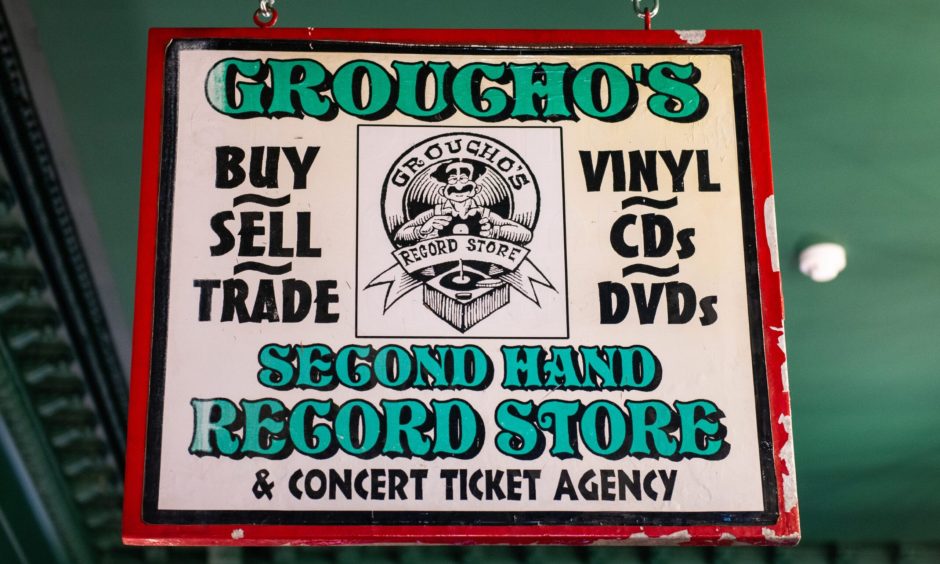 The original sign from when Groucho's was a secondhand record store.