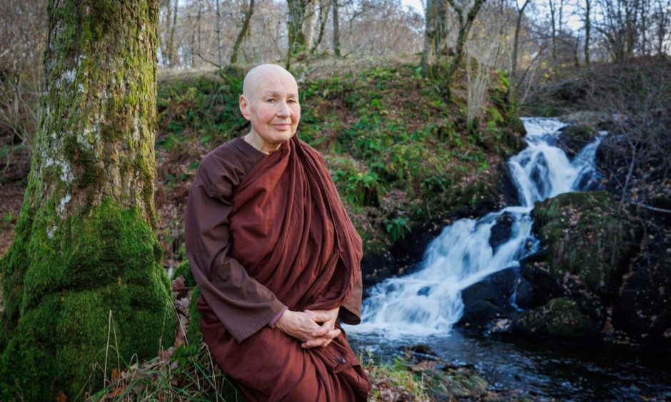 Buddhist nun Sister Ajahn Candasiri loves to meditate in woodland at Milntuim Hermitage in Glenartney. Image: Kenny Smith.