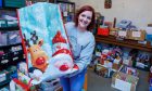 Toy Drive founder and Cupar social worker Victoria Leonard surrounded by toys which have been donated by the community for distribution to 500 needy North East Fife children at Christmas. Image: Kenny Smith/DC Thomson
