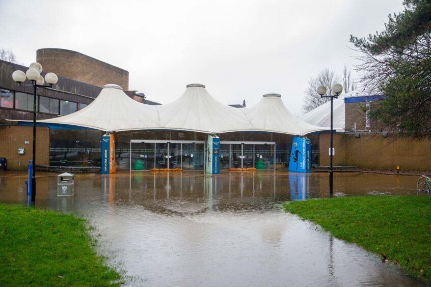 Bell's Sports Centre, Perth, with flood water outside after Storm Gerrit