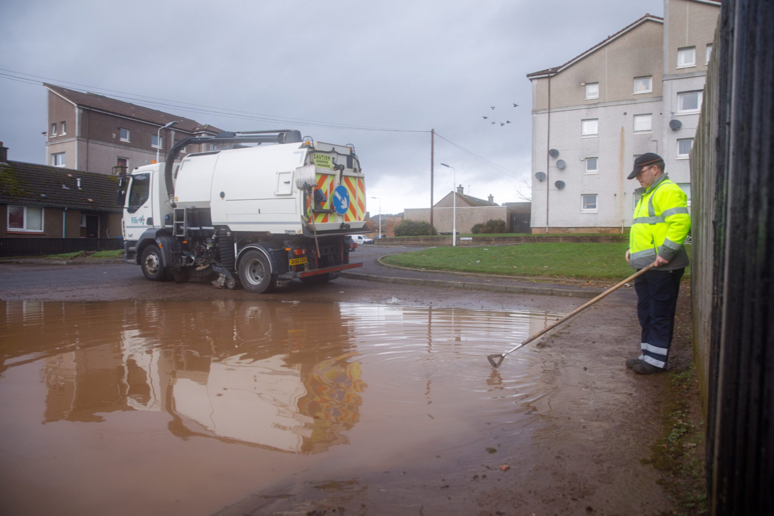 Council workers start the clean-up of the Kinloss Crescent area of Cupar after Storm Gerrit