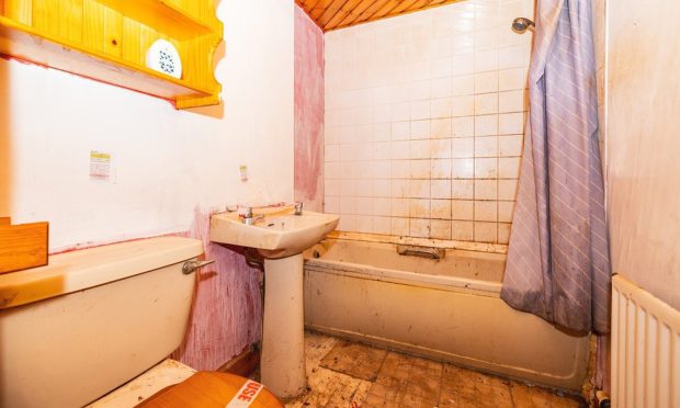 Bathroom of Dundee flat in need of extensive repairs