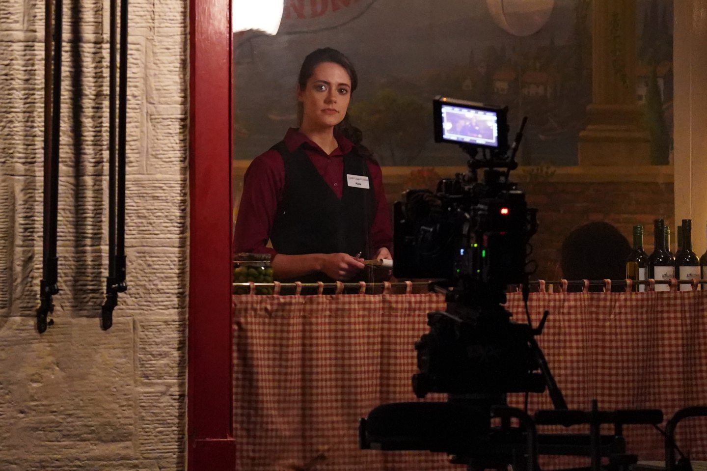 Kate Middleton (played by Meg Bellamy) working in the Pizzeria. Image: Andrew Milligan/PA Wire.