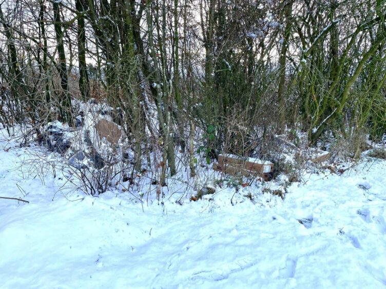 The snow covered pile of parcels found in woods in Dunfermline.