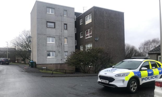 Police outside a block of flats on Auchinblae Place, Dundee. Image: James Simpson/DC Thomson