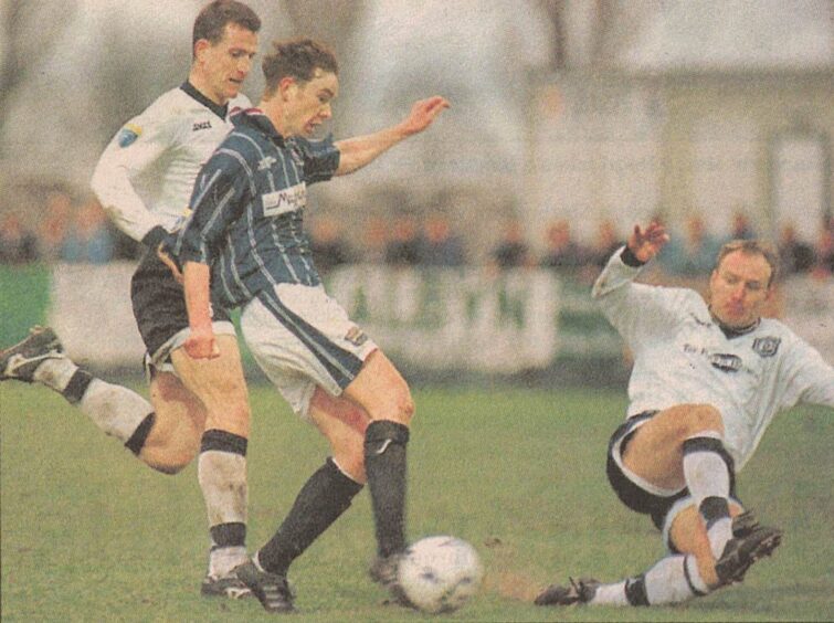 Ross County's Derek Adams takes on Dundee in 1998.