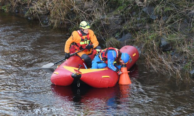 Water rescue teams searching the River Tay in Perth. Image: Stuart Cowper