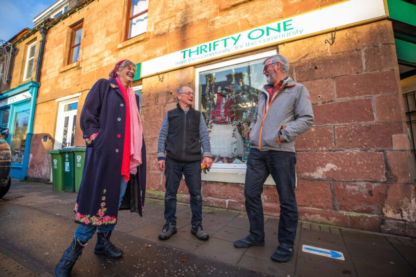 George and Michele Hall talking to a smiling George Brown outside the Thrifty One shop in Alyth