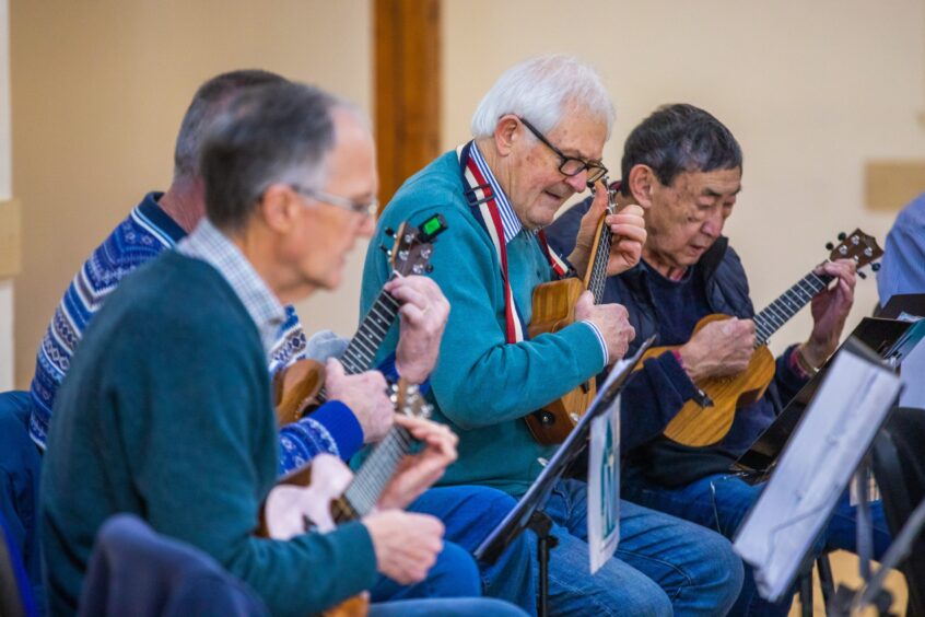 Auchterarder Men's shed members rehearsing on the ukulele