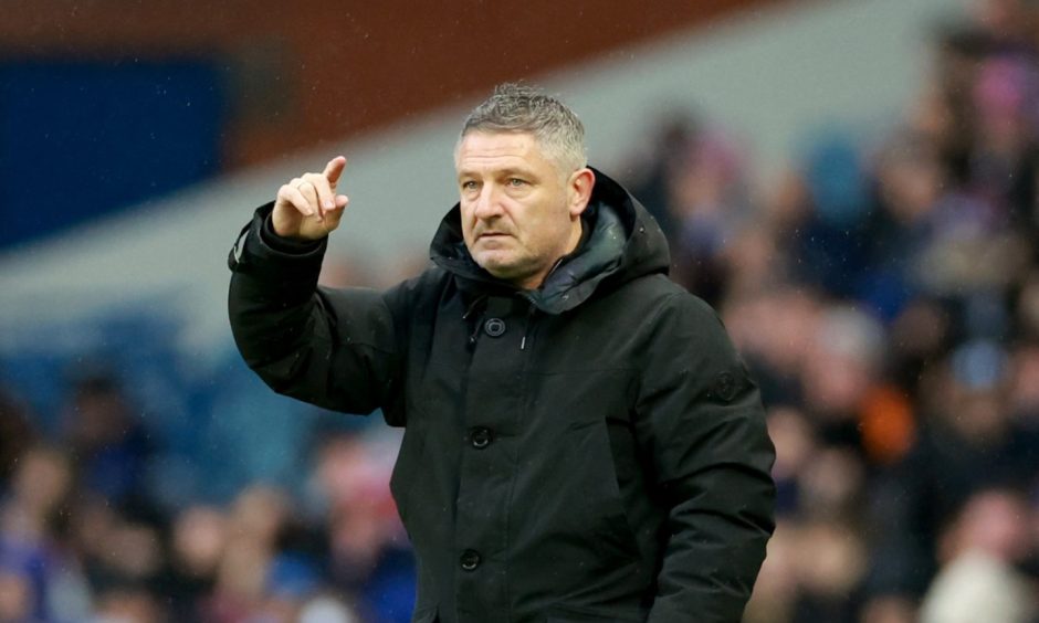 Tony Docherty in the dugout at Ibrox. Image: PA