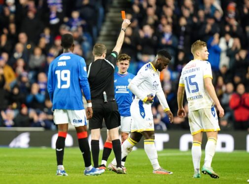 DJ Jaiyesimi is shown a red card at Ibrox.