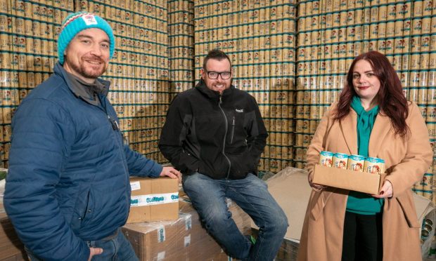 CoelBrew gluten-free beer founders Ryan Bald and David Hamilton, alongside Shona Gillespie inside the Guardbridge warehouse. Image: Steve Brown/DC Thomson.