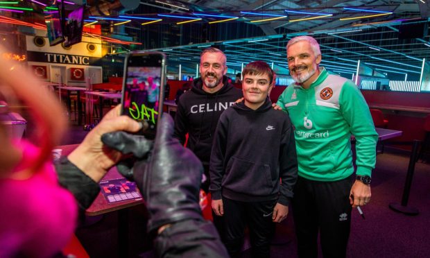 Fans meet and get their 2024 calendars signed by the players at the DUFC bowling event at Tenpin in Dundee . All Images: Steve Brown/DC Thomson