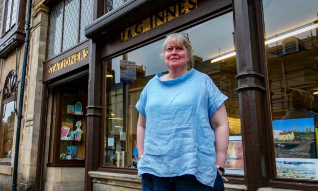 Jude Innes outside the J&G Innes premises on South Street in St Andrews. Image: Steve Brown/DC Thomson.