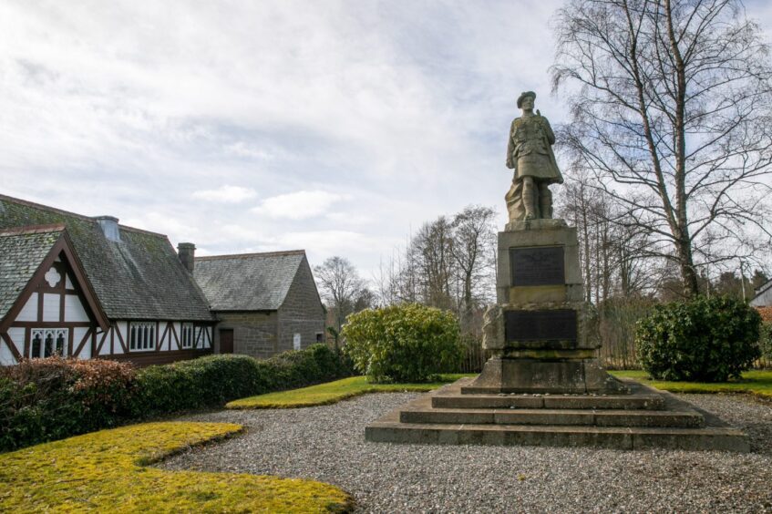 Stanley war memorial with episcopal church alongside