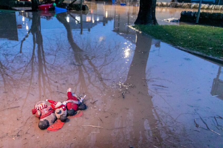 Christmas decorations floating down the street. 