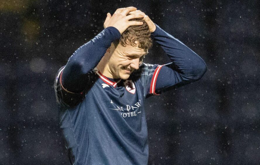 Raith Rovers striker Jack Hamilton holds his head in his hands Image: SNS.