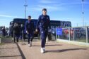 Charlie Reilly arrives with the Dundee team at McDiarmid Park. Image: Shutterstock/David Young