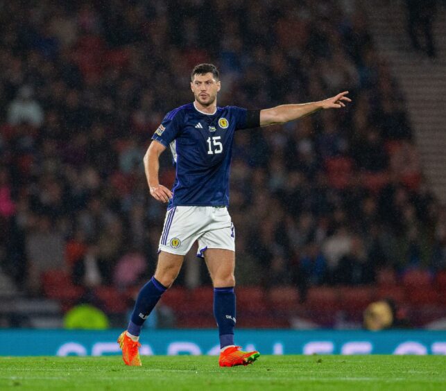 Scott McKenna plays for Scotland against Ukraine