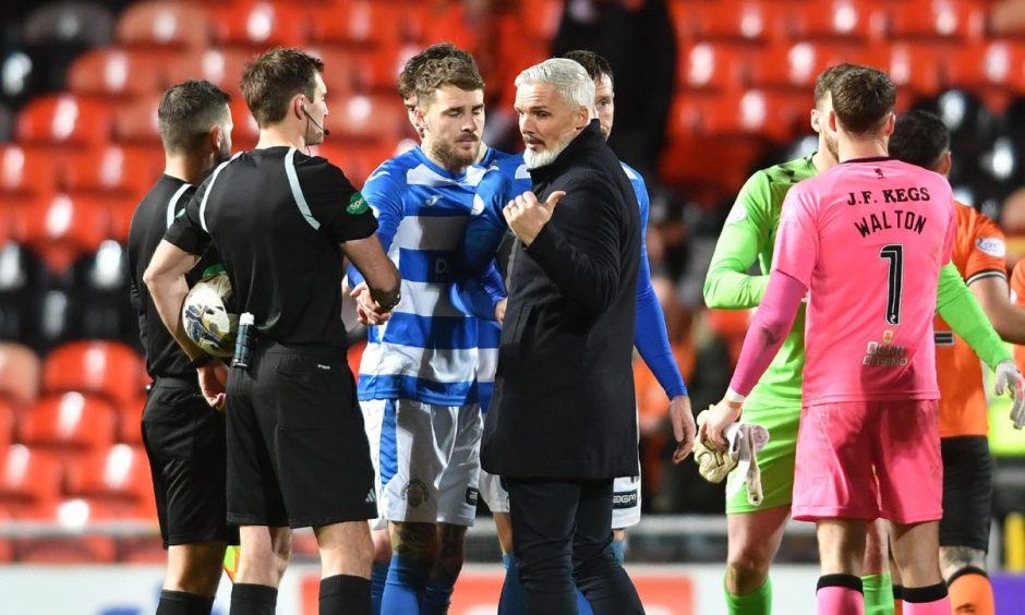 Dundee United boss Jim Goodwin approaches referee Iain Sneddon