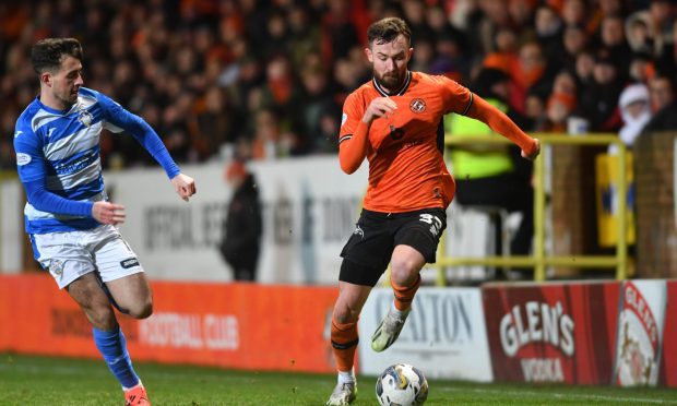 Dundee United's Scott McMann back at full pelt, mere days after a seemingly nasty ankle knock
