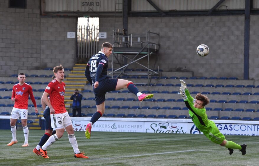 Jack Hamilton leaps to head in the opener for Raith Rovers. Image: Mark Runnacles / Shutterstock.
