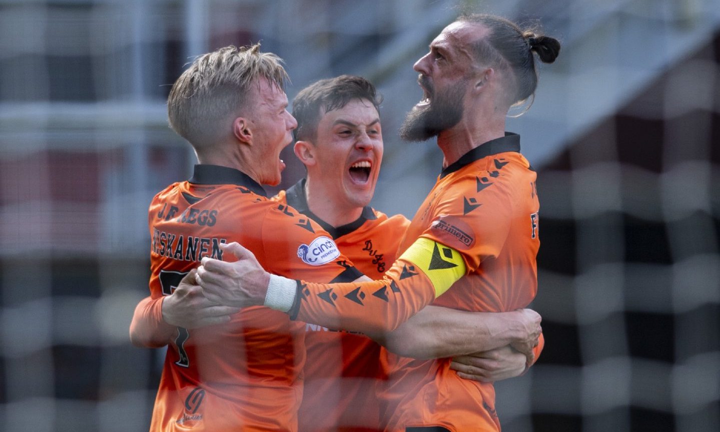 Dundee United players celebrate the late winner at the game at which the banned teenager was spotted. Image: SNS.