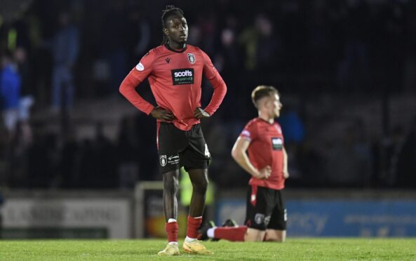 Malachi Boateng dejected during his time at Queen's Park. Image: SNS